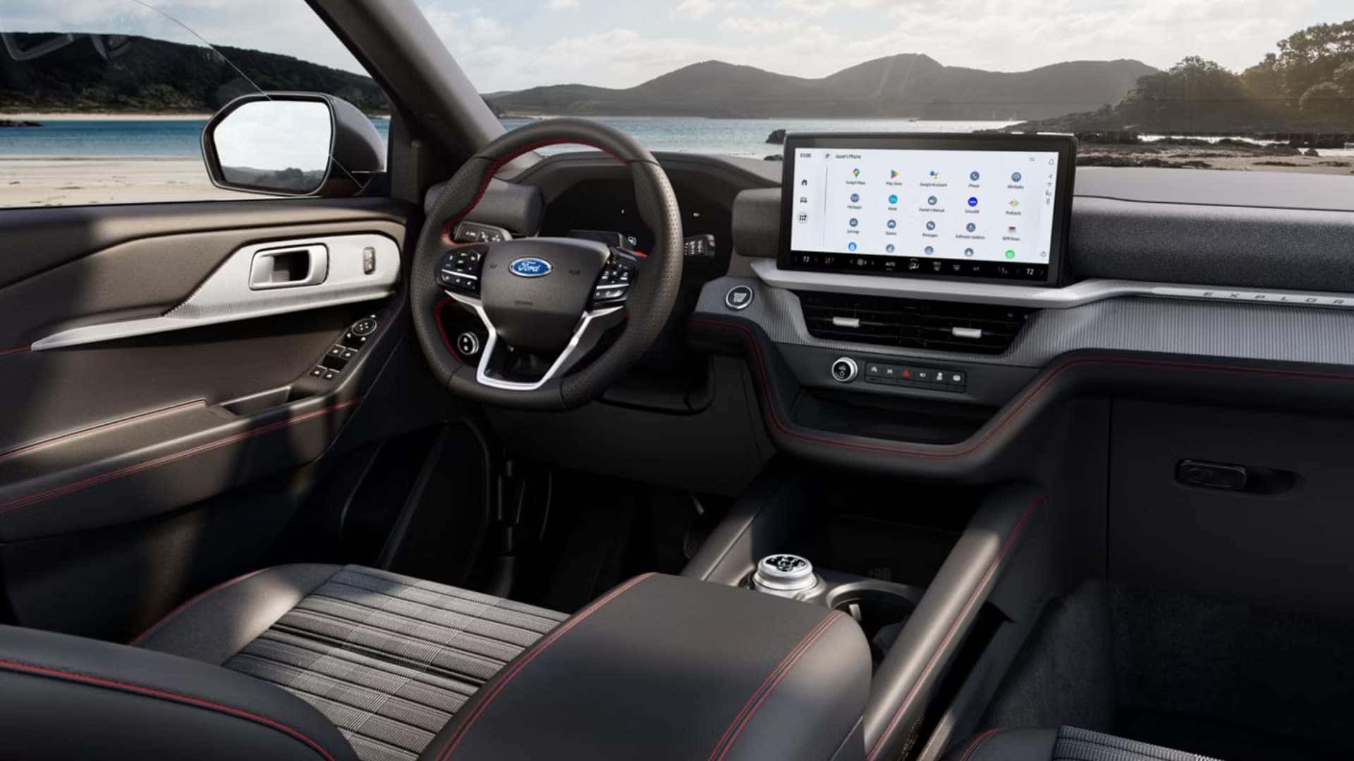 2026 Ford Explorer® front interior view highlighting driver seat, center console, and large touchscreen display with app icons