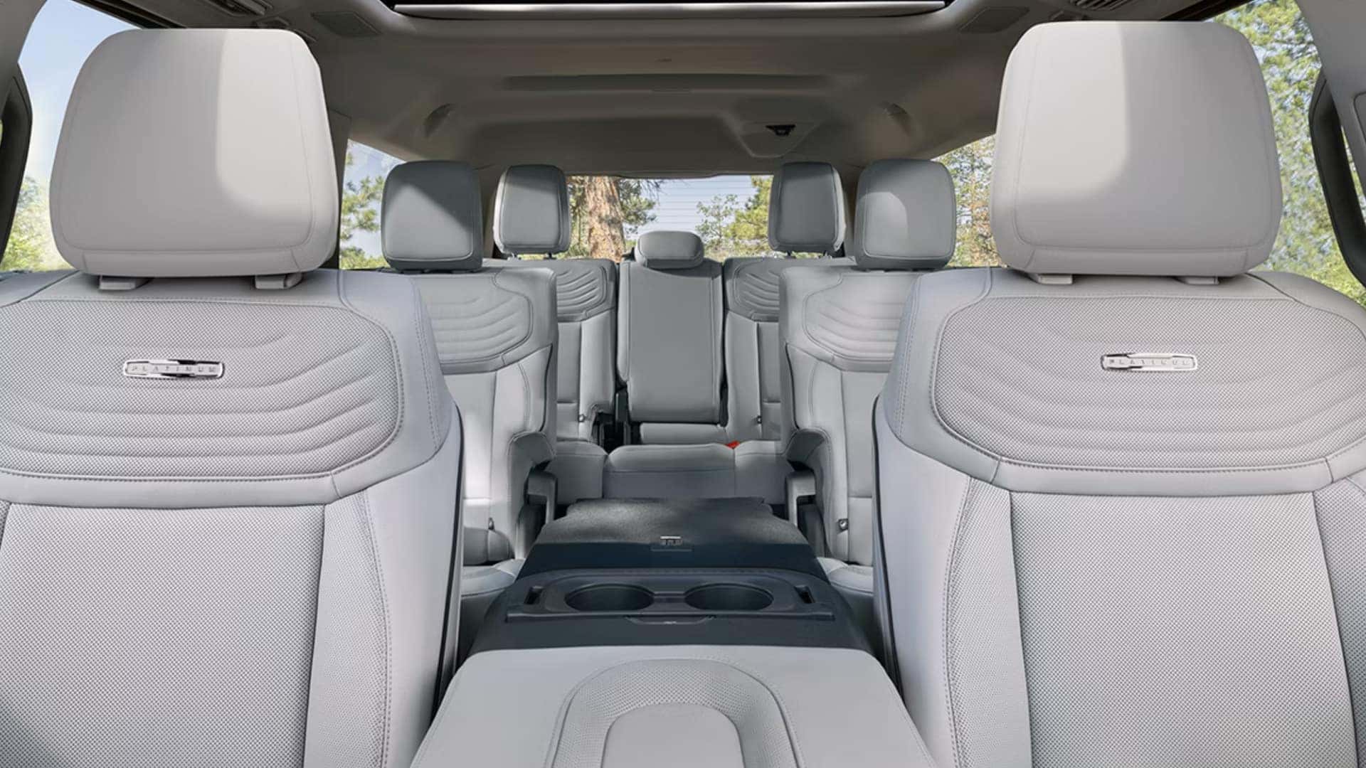 2026 Ford Expedition® three-row cabin with light leather seating, Platinum trim details, and panoramic roof.