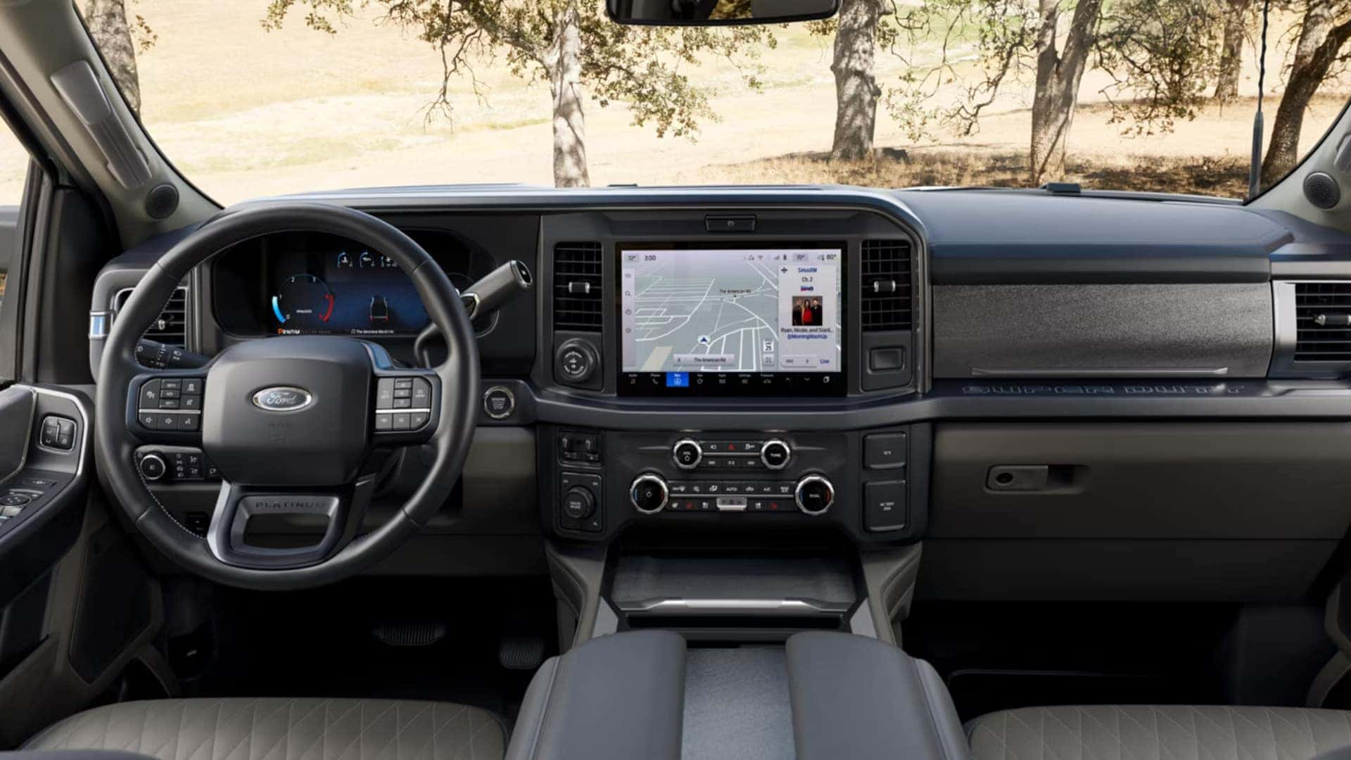 2026 Ford Super Duty® interior dashboard with digital driver display, central touchscreen, and Platinum trim details.