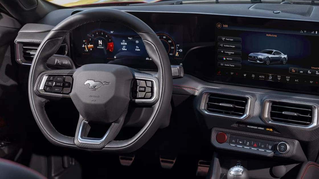 2026 Ford Mustang® cockpit with digital gauges, touchscreen display, and performance-focused controls.