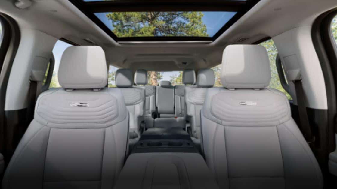 2026 Ford Expedition® cabin with white leather seating, panoramic glass roof, and roomy three-row interior.