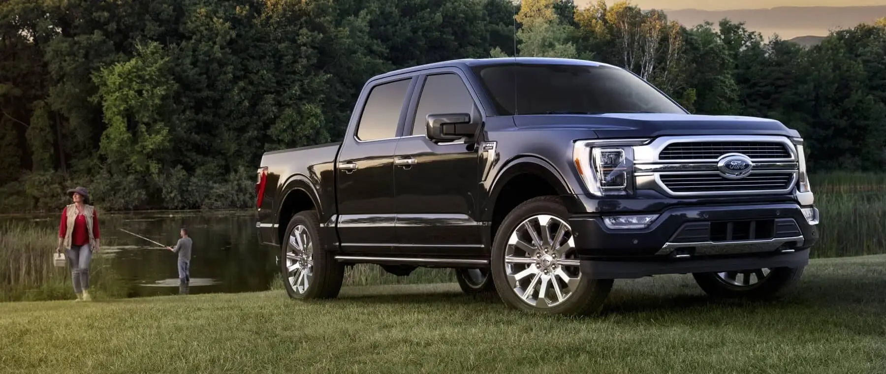 Germain Ford of Columbus - Ford F-150 in grass with people fishing in background