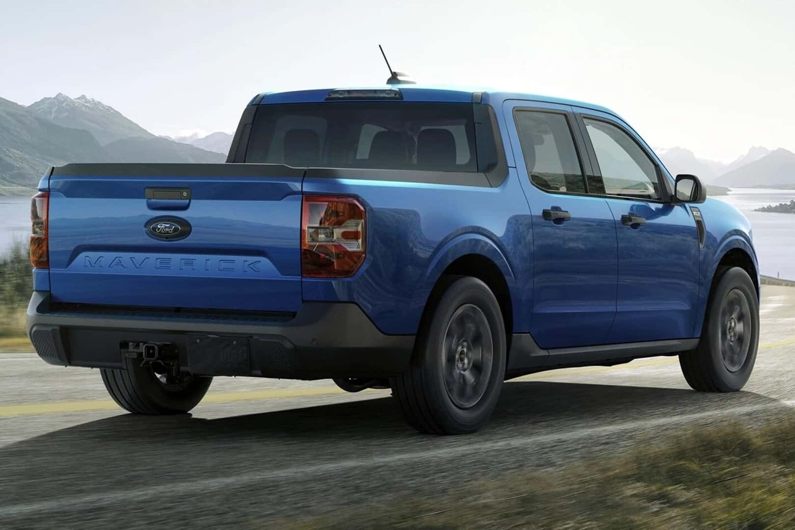2025 maverick truck driving on road with mountains in background