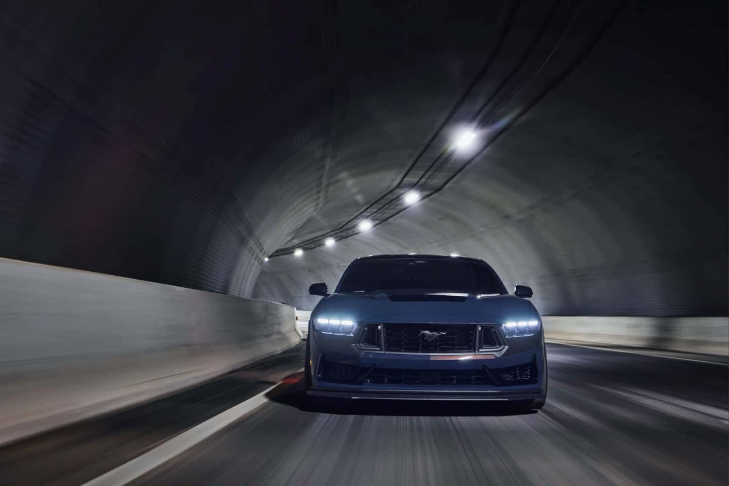 2026 Ford Mustang Dark Horse driving through a tunnel