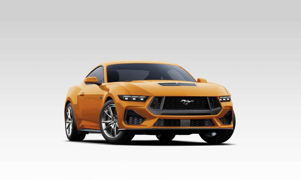 2026 Ford Mustang GT in orange, studio shot