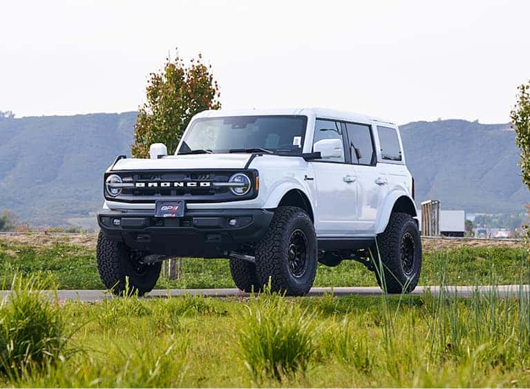 ford bronco parked in grass
