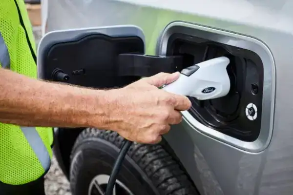 Workman-Charging-a-Vehicle