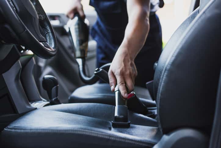 man cleaning car during spring cleaning