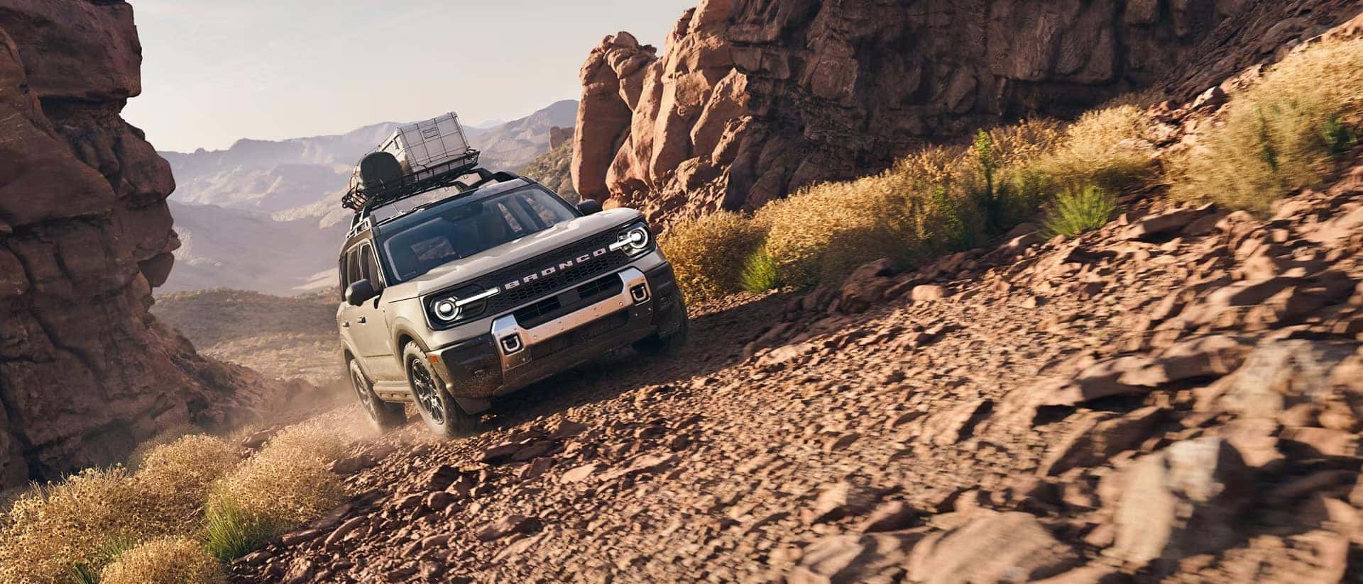 A 2025 Bronco Sport climbs a steep rocky trail A 2025 Bronco Sport climbs a steep rocky trail