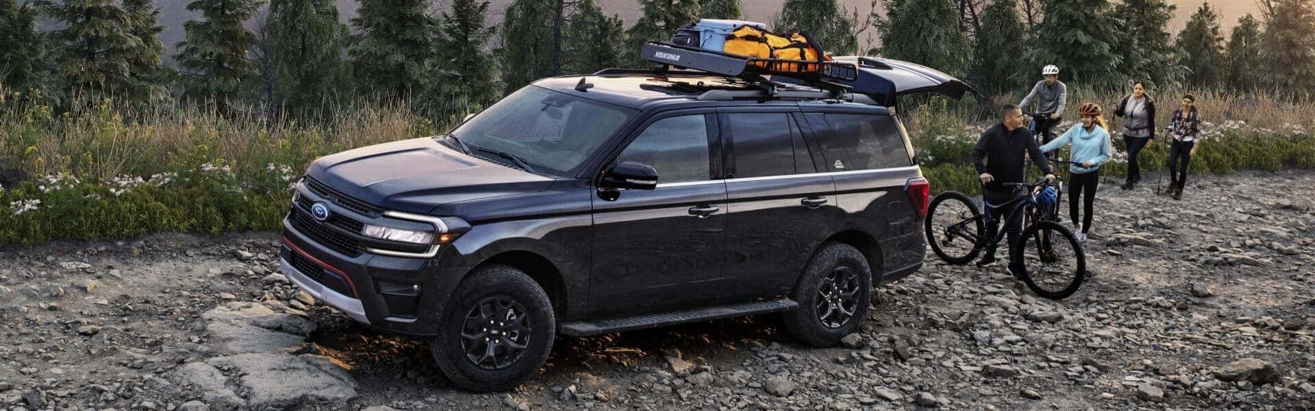 2024 Ford Expedition Parked Off-Road Near Bicycle Riders