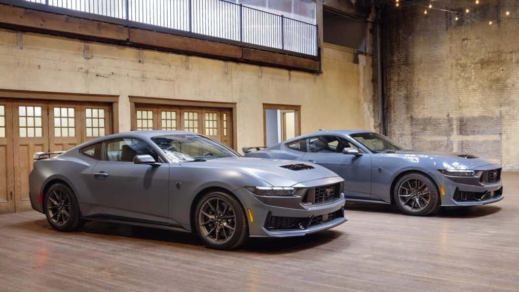 2026 Ford Mustang Dark Horse and Dark Horse Premium trim parked side by side in old wharehouse