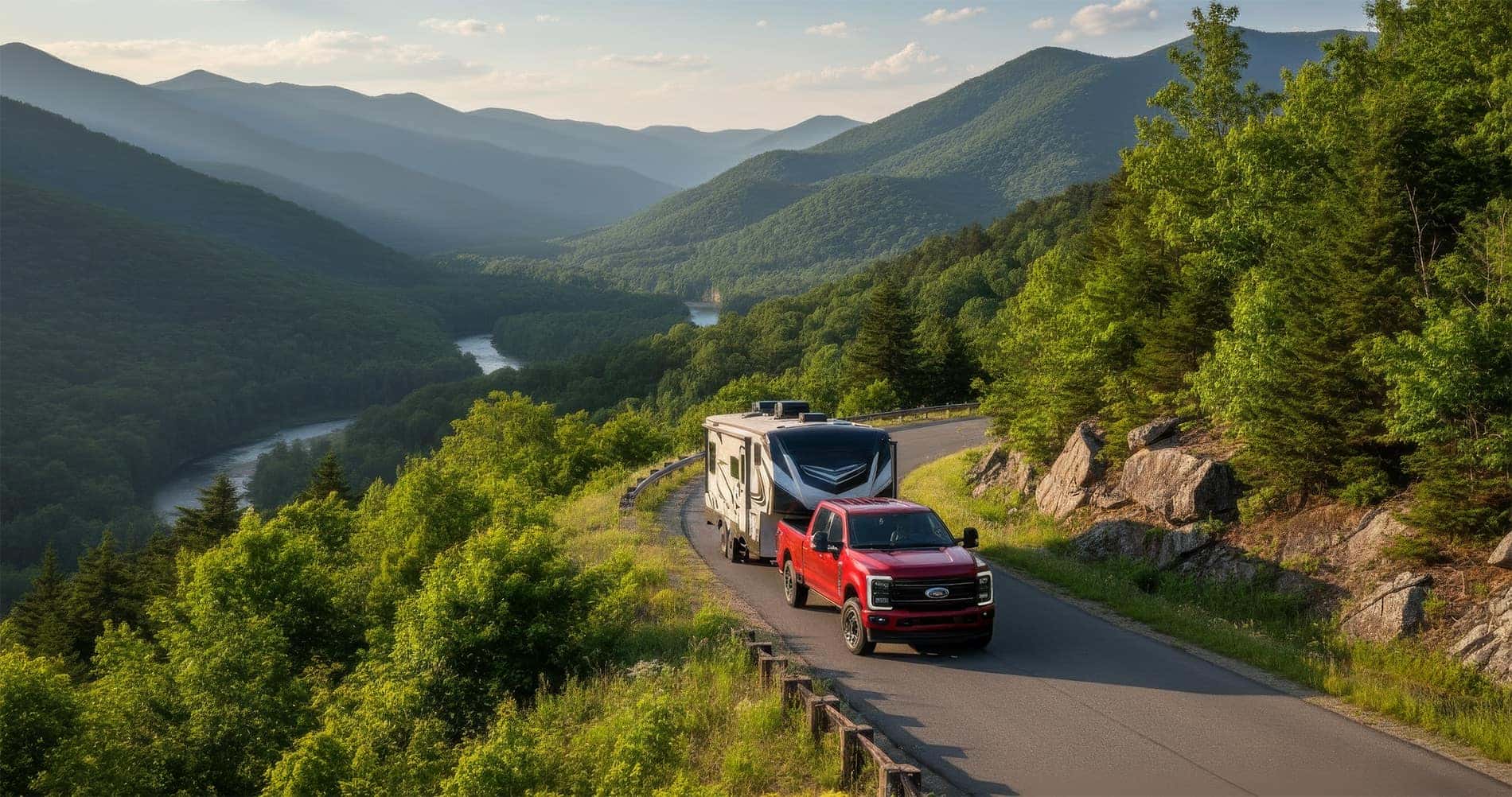 2026Ford F-250 towing camper through winding mountain road in North Georgia mountains