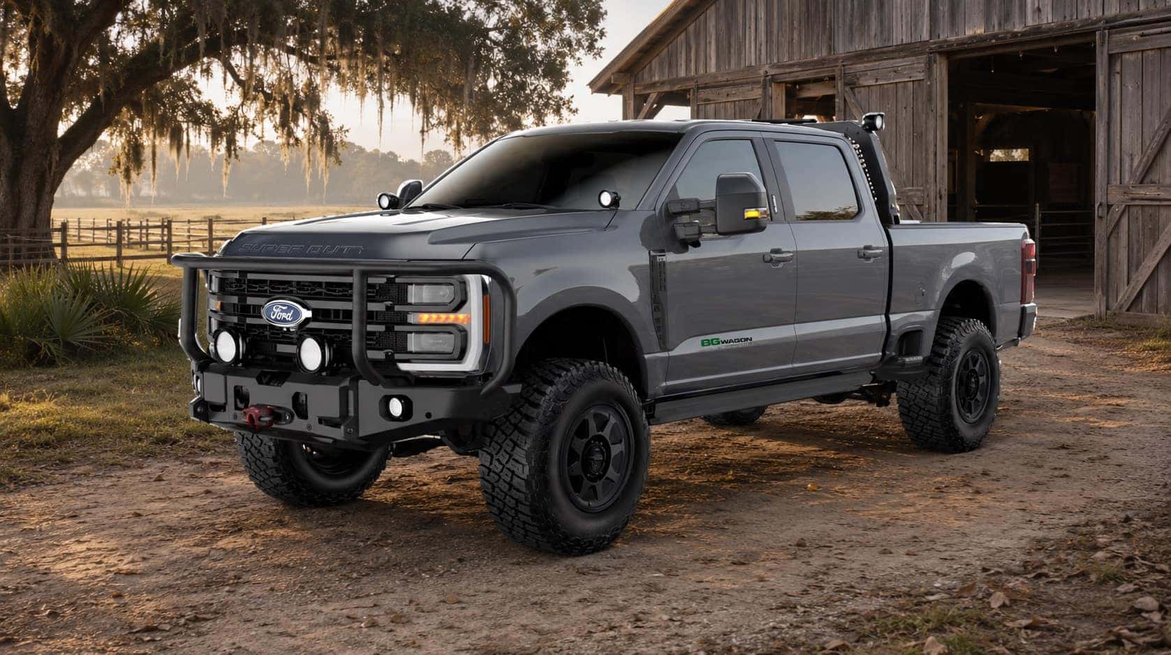 Dark gray 2026 Ford AGwagon AG+ Edition Super Duty parked beside a barn on a Lowcountry ranch near Savannah, Georgia.