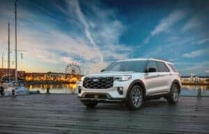 white 2025 Ford Explorer in front of fair and ferris wheel