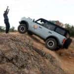 Ford Bronco driving up a steep hill at the Off-Roadeo experience in Texas