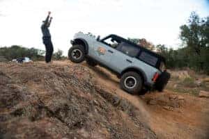 Ford Bronco driving up a steep hill at the Off-Roadeo experience in Texas