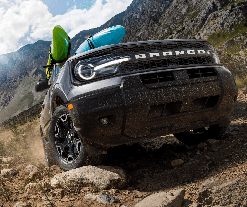 2024 Ford Bronco Sport navigating rugged outdoor terrain, showcasing off-road capability and durable design for adventure seekers
