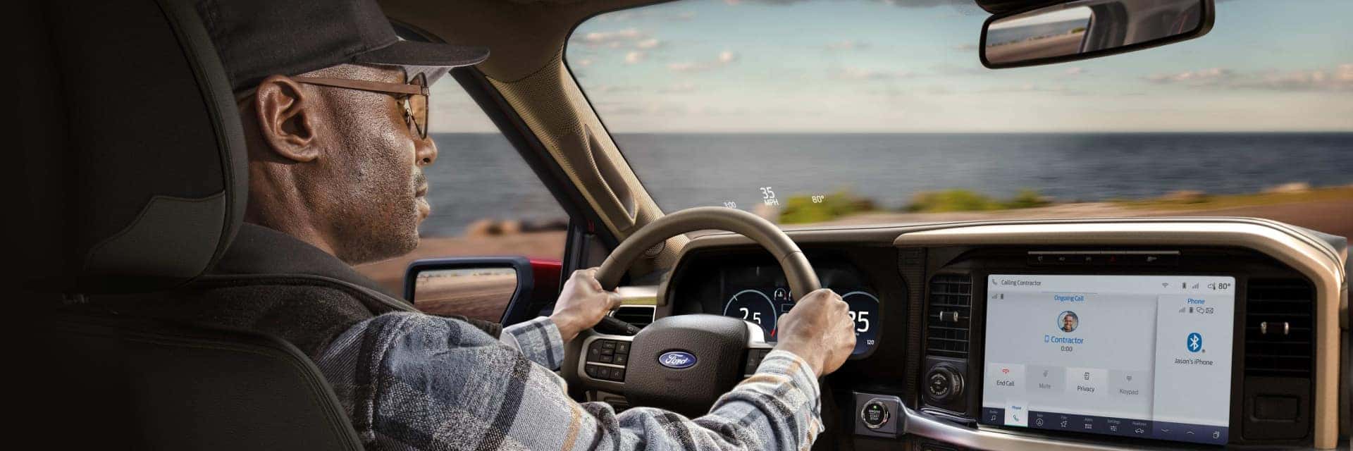 man driving ford vehicle