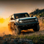 Ford Bronco driving in sand