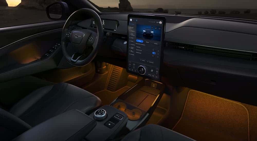 Orange ambient lighting in the cabin of a 2025 Ford Mustang Mach-E.