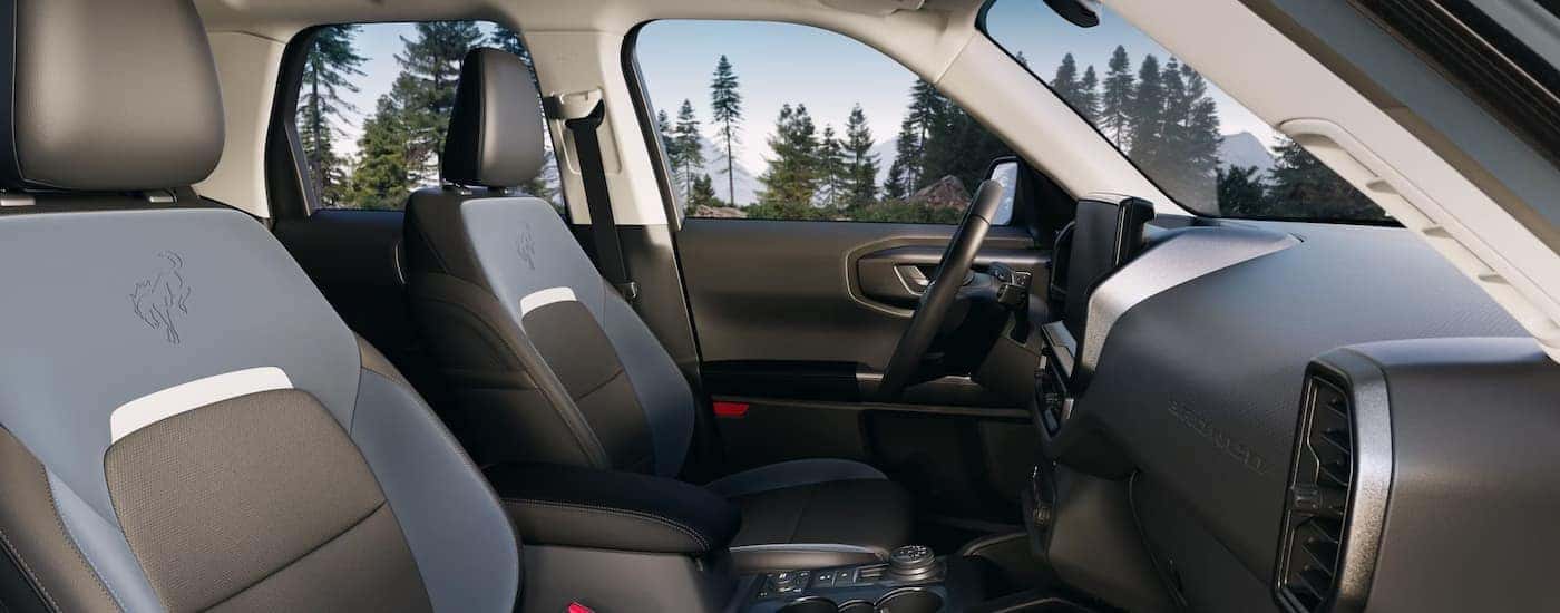 The black and blue interior and dash are shown in a 2025 Ford Bronco Sport.