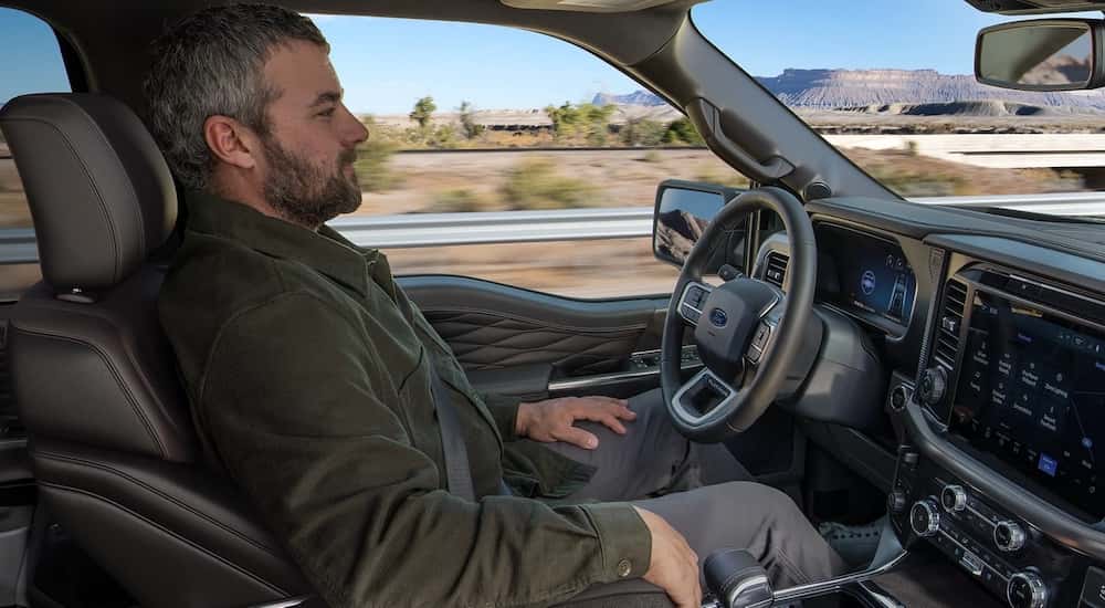 Man using BlueCruise inside a 2025 Ford F-150.