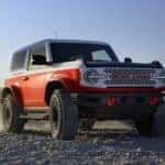 A multi-colored 2025 Ford Bronco Stroppe Edition parked off-road.