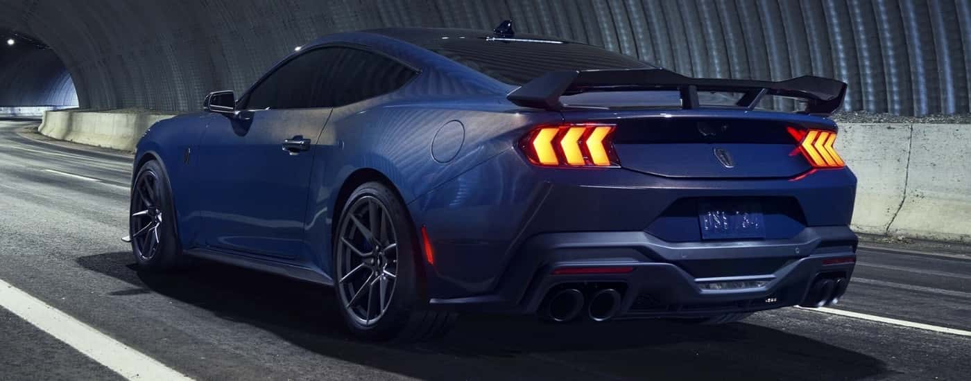 A blue 2025 Ford Mustang Dark Horse in a tunnel.
