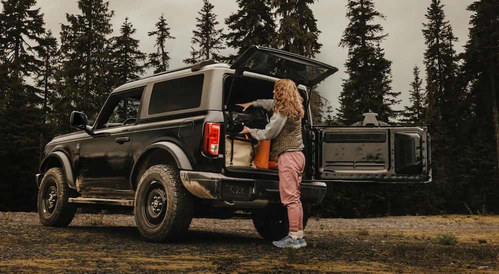 A black 2025 Ford Bronco parked off-road.
