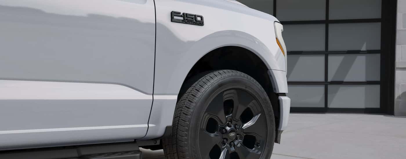 Exterior details on a white 2025 Ford F-150 Lightning Platinum.