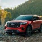 A red 2026 Ford Explorer ST parked off-road.