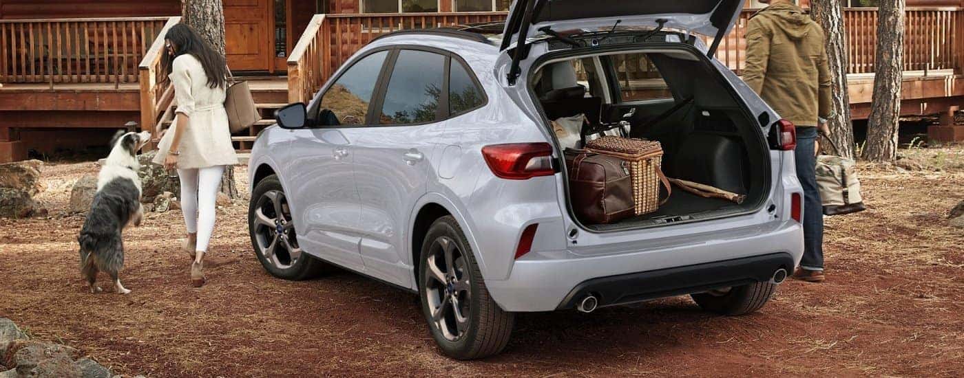 Grey 2026 Ford Escape ST-Line parked at a cabin