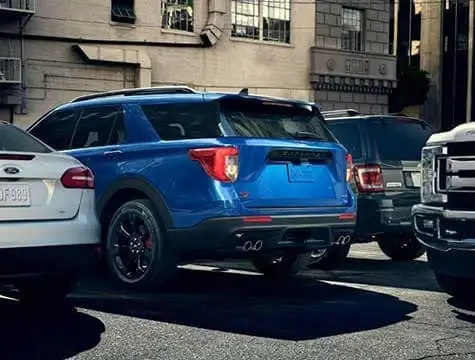 Rear-view-of-a-Blue-Ford-Explorer-parked-in-a-parking-lot