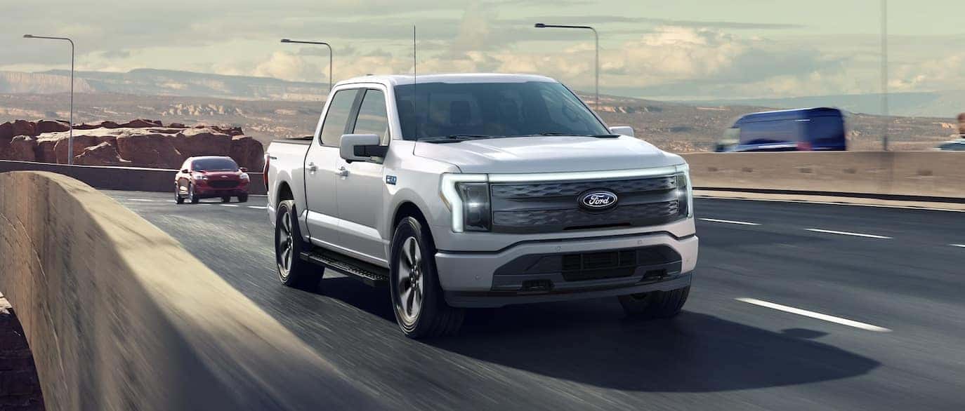 White Ford F-150 Driving On The Highway