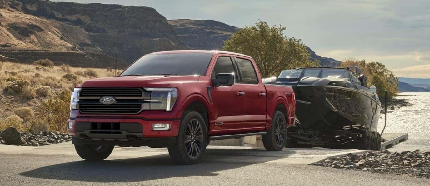 Red Ford-150 Truck Towing a Boat