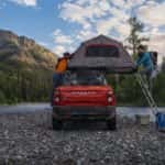 An orange 2023 Ford Bronco Sport is shown from the rear after leaving a Ford SUV dealer.