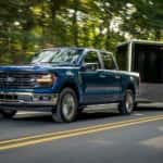 A blue 2025 Ford F-150 is shown from the front at an angle after leaving a dealer that has a Ford F-150 for sale near Snellville.
