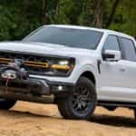 A white 2025 Ford F-150 Tremor is shown from the front at an angle.