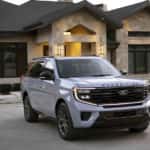 A grey 2025 Ford Expedition is shown parked on a driveway.