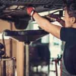 A tech is shown performing auto repair near Monroe.