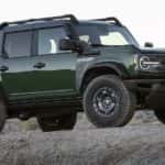 A green 2022 Ford Bronco Everglades is shown from the front at an angle after leaving a used Ford dealer Loganville..