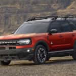 A red 2025 Ford Bronco Sport is shown from the front at an angle after leaving a Ford dealer near Decatur..