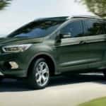A green 2019 Ford Escape is shown from the side after leaving a used Ford dealer Loganville.
