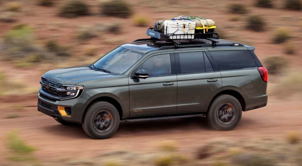A green 2025 Ford Expedition is shown from the side.