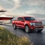A red 2025 Ford F-150 from the front at an angle.