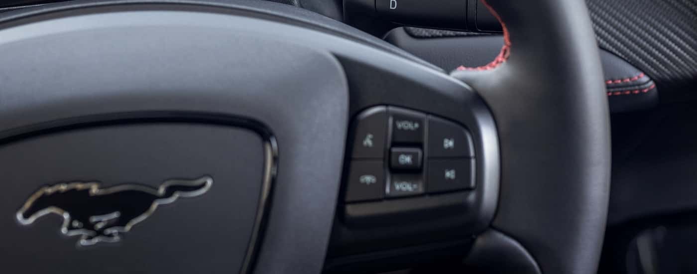 Buttons on the steering wheel in a 2025 Mustang Mach-E Premium.