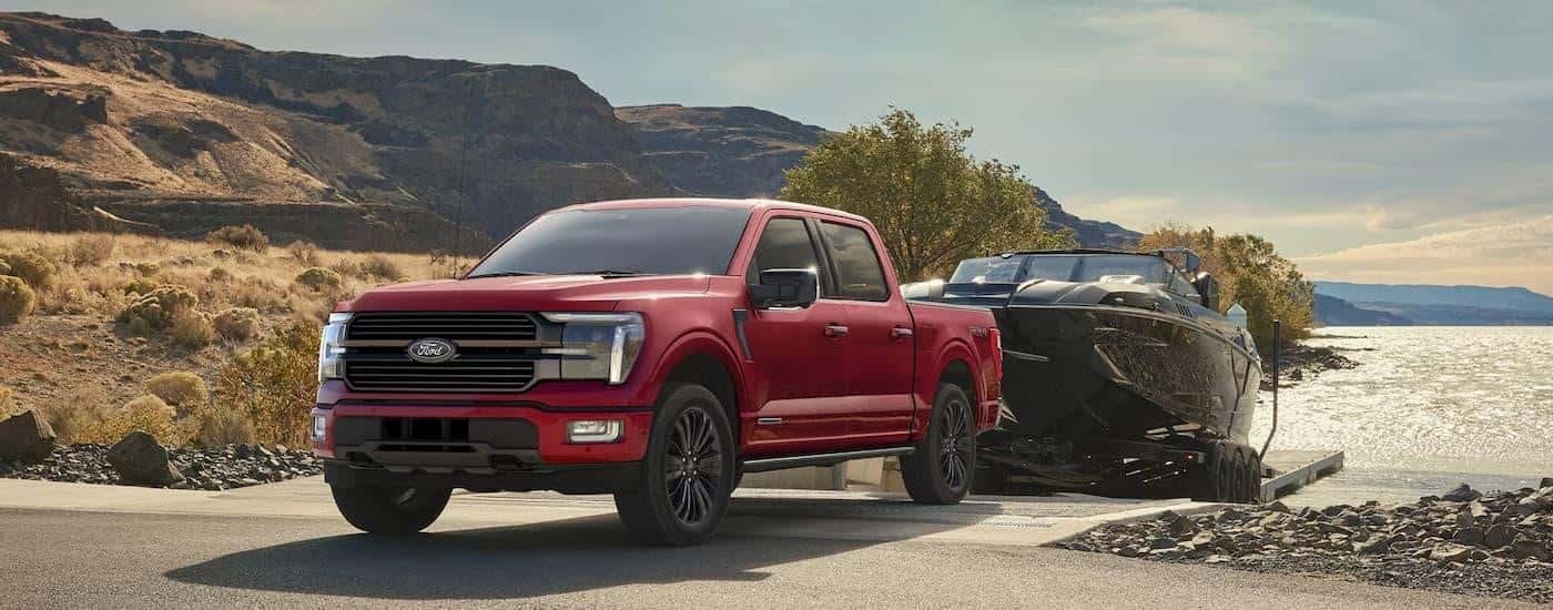 A red 2025 Ford F-150 for sale near Conyers from the front.