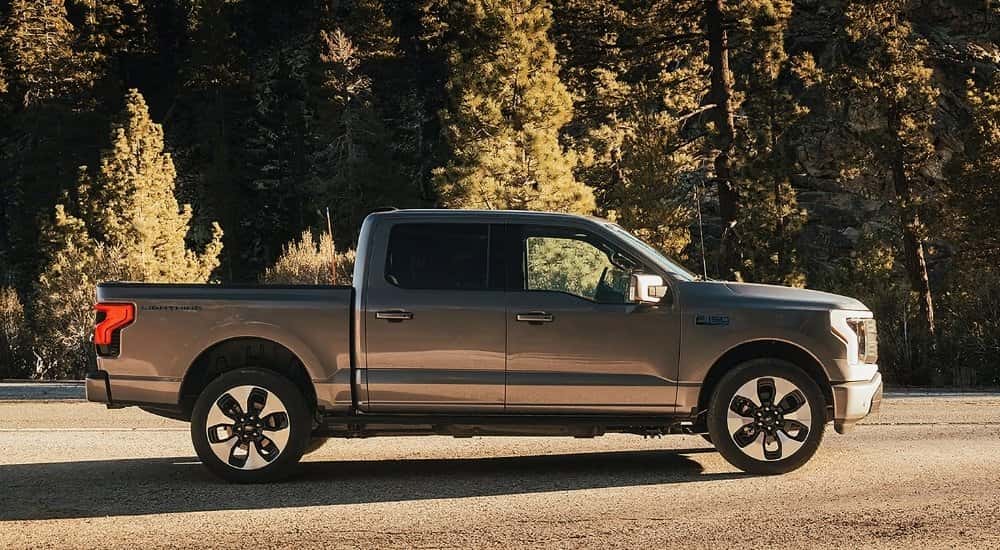 A silver 2025 Ford F-150 Lightning from the side.