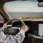 A person driving in a 2025 Ford F-150.
