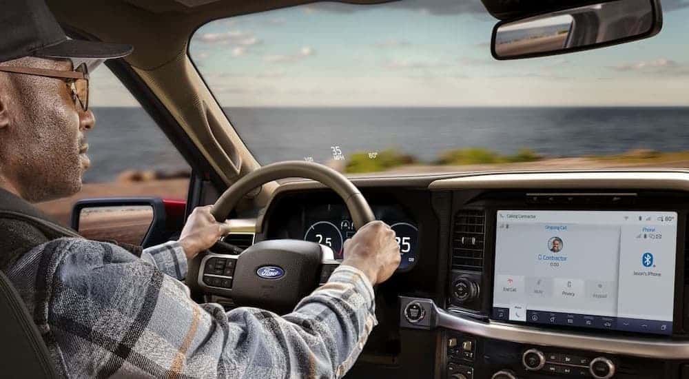 A person driving in a 2025 Ford F-150.
